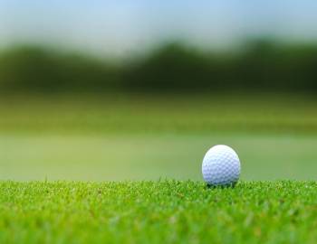 Gold ball on green