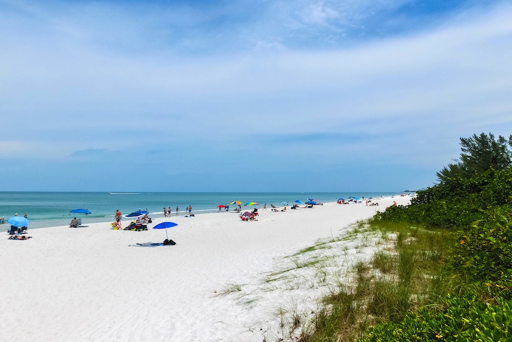 Tourists enjoying vanderbilt beach