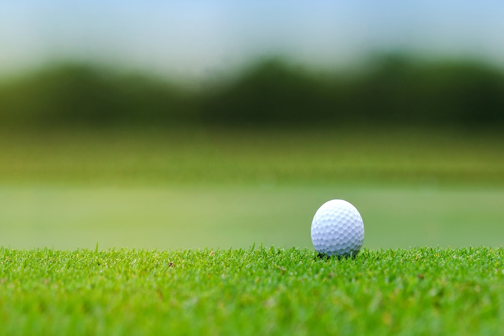 Gold ball on green