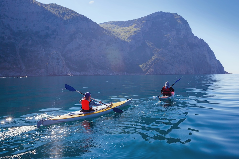 two people kayaking on a. guided tour